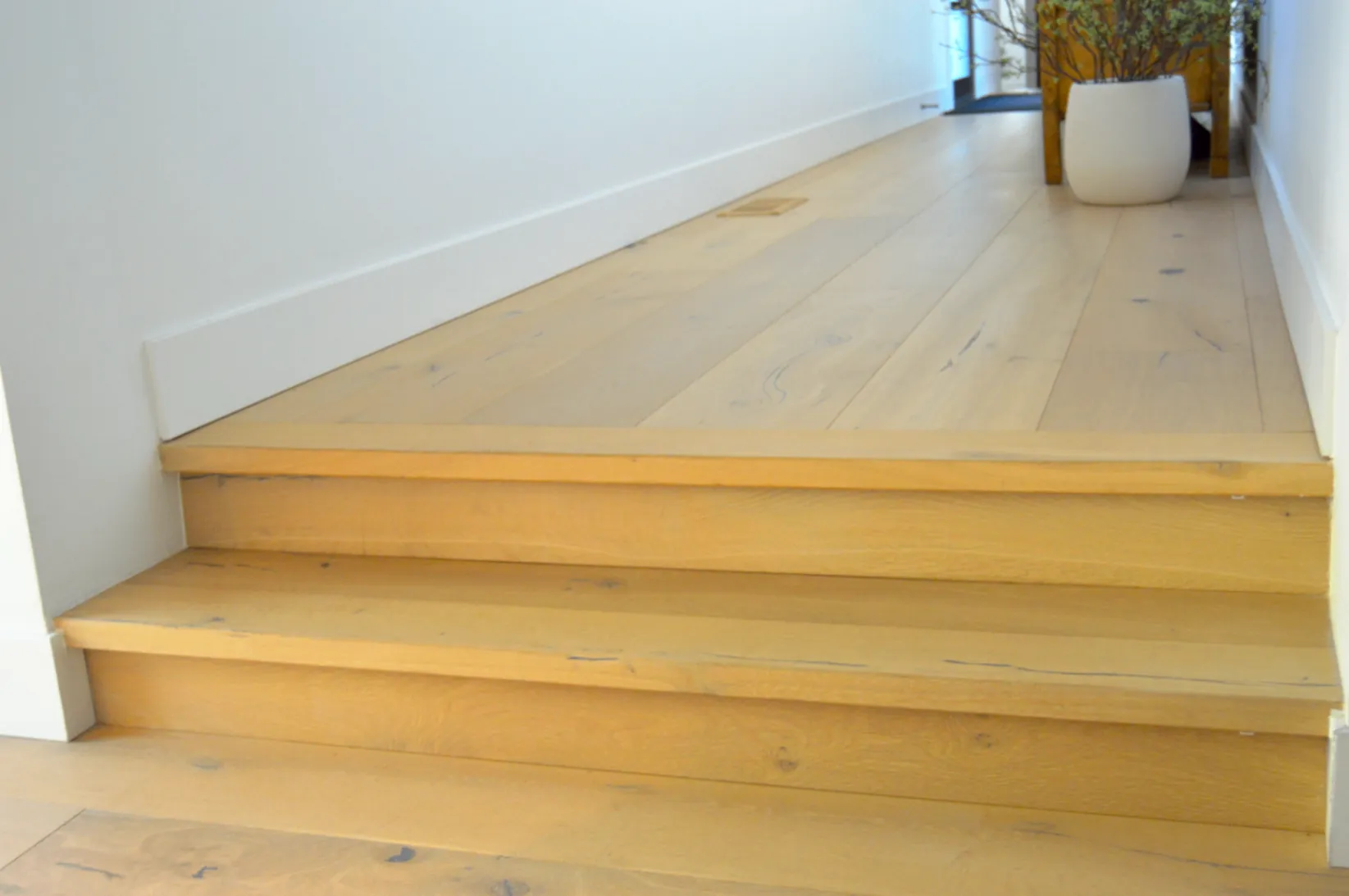 Wide-plank landing meeting stair treads
