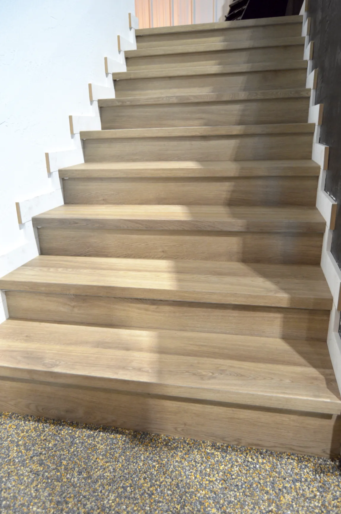 Wide oak stair treads and risers in a sample display