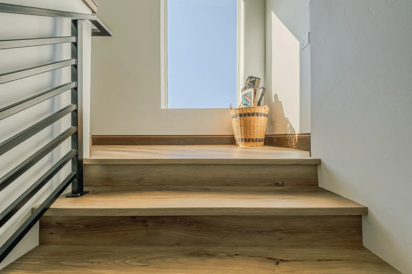 Sunlit landing steps in LVP with matching floor